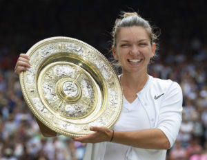 Simona Halep with the trophy after winning Wimbledon 2019
